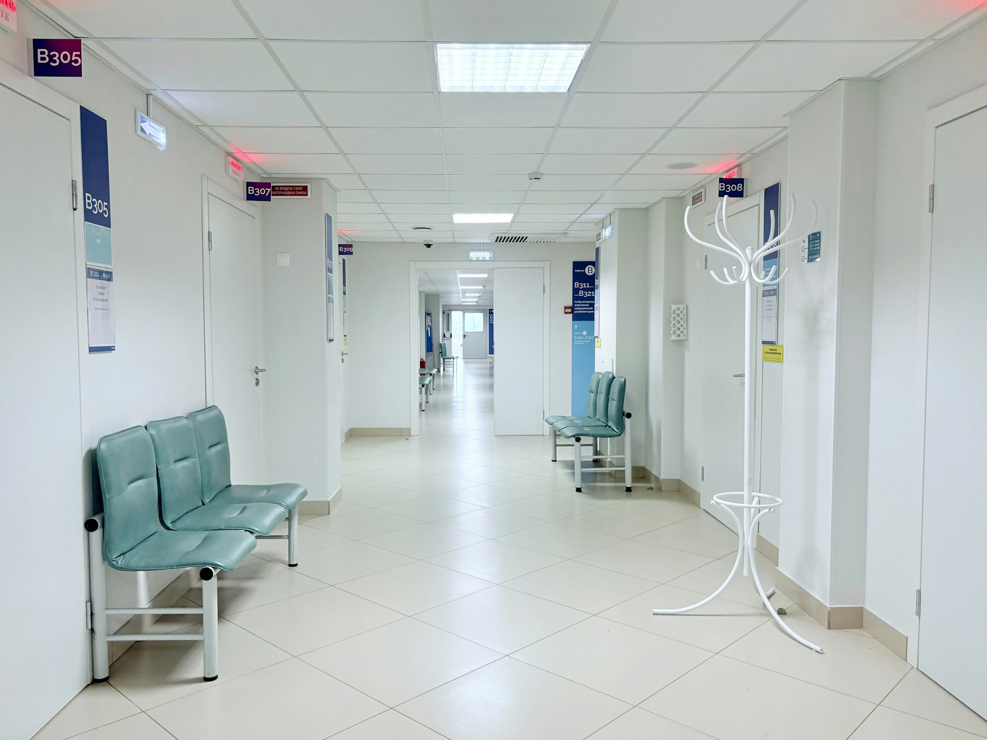 Empty hospital corridor with benches