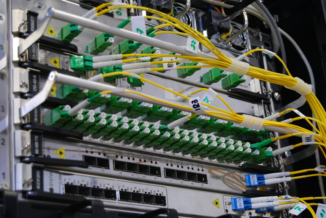 Fiber optic cables plugged into a network switch