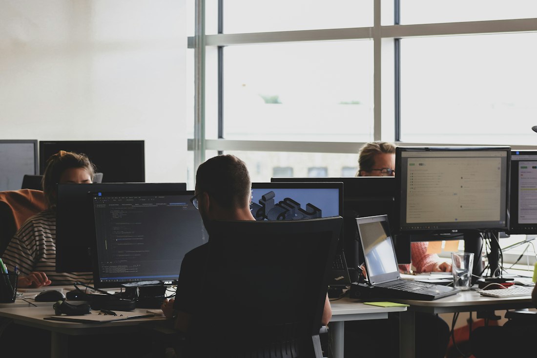 Security analysts working at their monitors